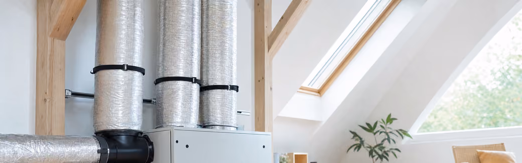 Caisson de VMC double flux dans des combles aménagés